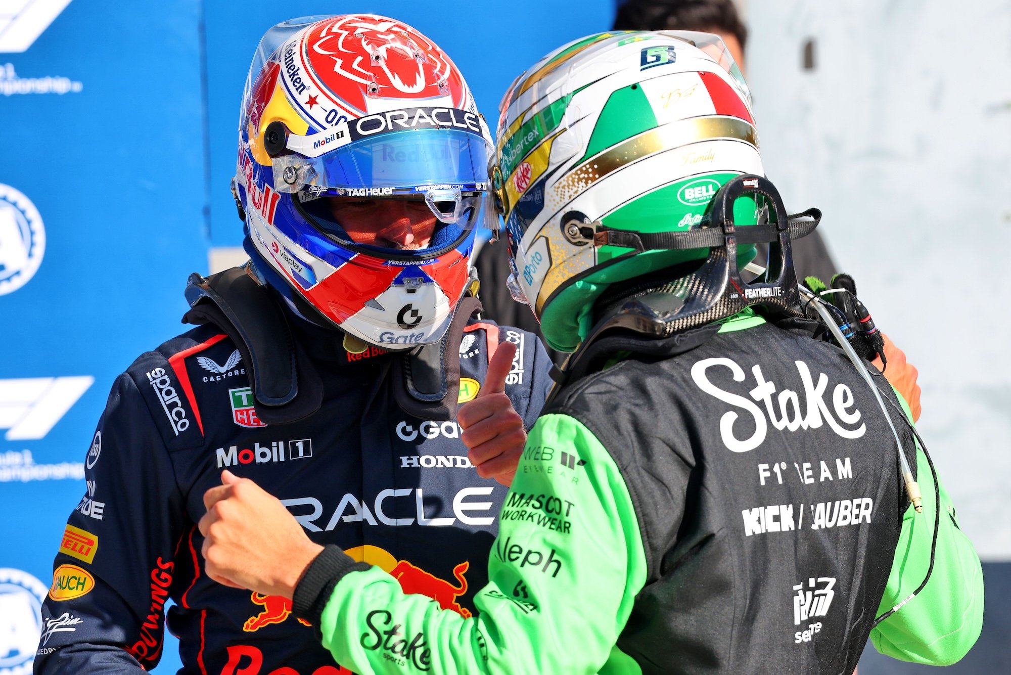 (L to R): Max Verstappen (NLD) Red Bull Racing celebrates his pole position in qualifying parc ferme with Gabriel Bortoleto (BRA) Sauber
